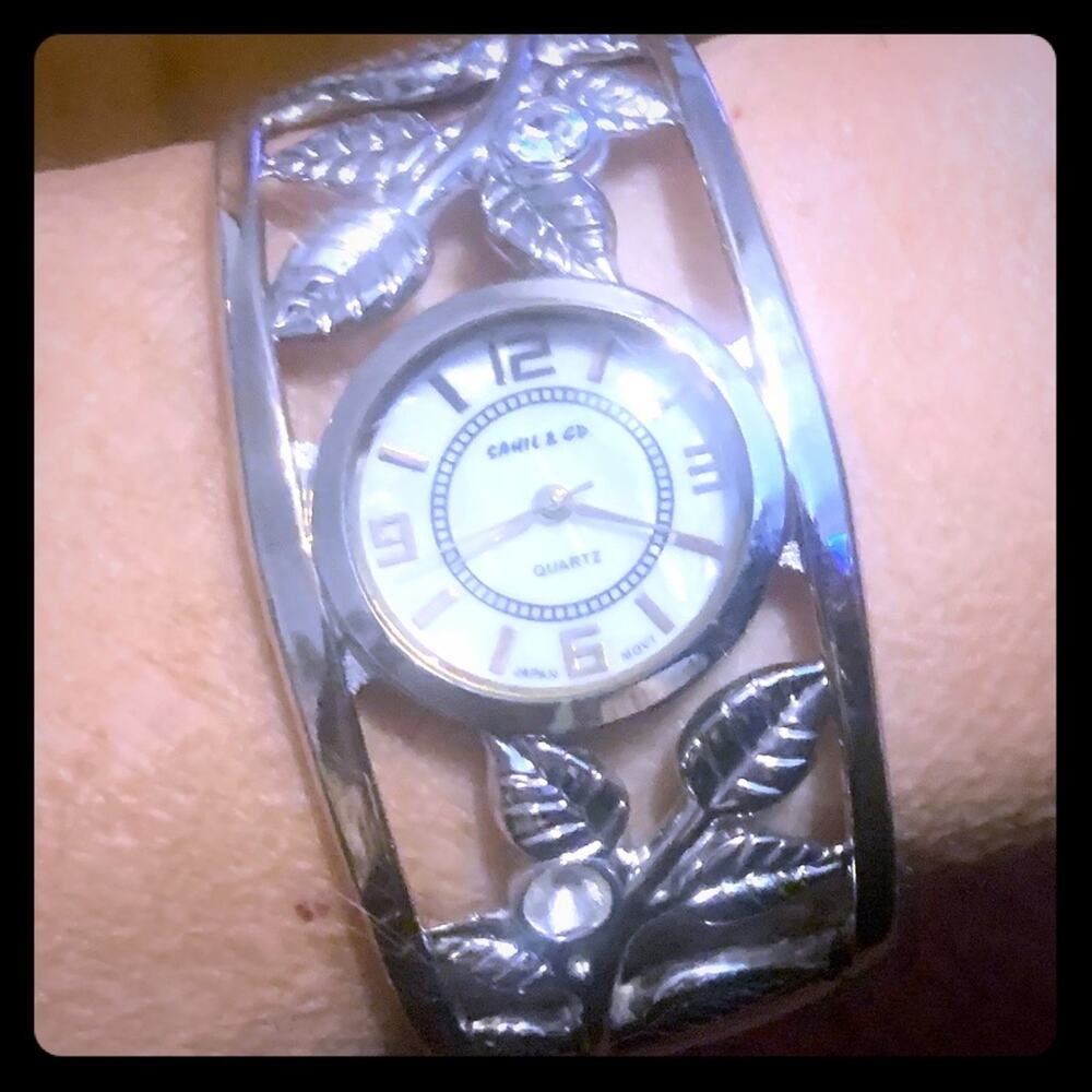 Bangle bracelet watch with mother of pearl face